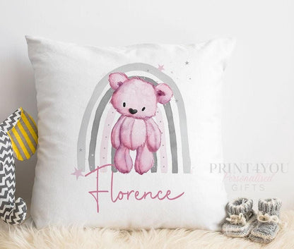 Personalised teddy bear cushion with a pink rainbow nursery design, alternate view showing the printed name