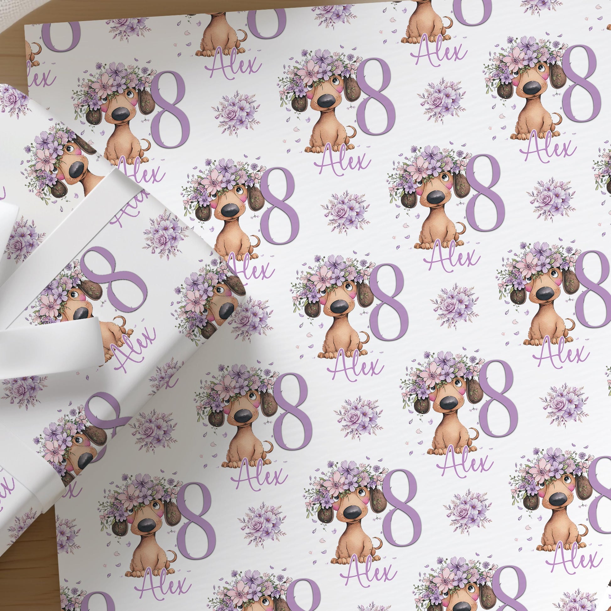 Personalised lilac floral dachshund birthday wrapping paper featuring a sausage dog design with custom age and name.