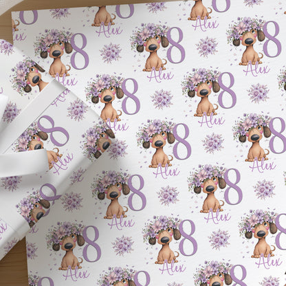 Personalised lilac floral dachshund birthday wrapping paper featuring a sausage dog design with custom age and name.