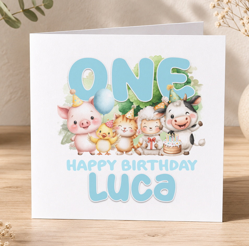 First birthday card illustrated with a pig, cat, cow and duck, printed with 'One Happy Birthday Luca' as a personalisation example.