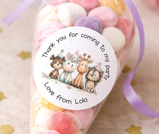 Personalised round safari animal stickers printed with a child's name, showing jungle-themed designs for party bags and favours.