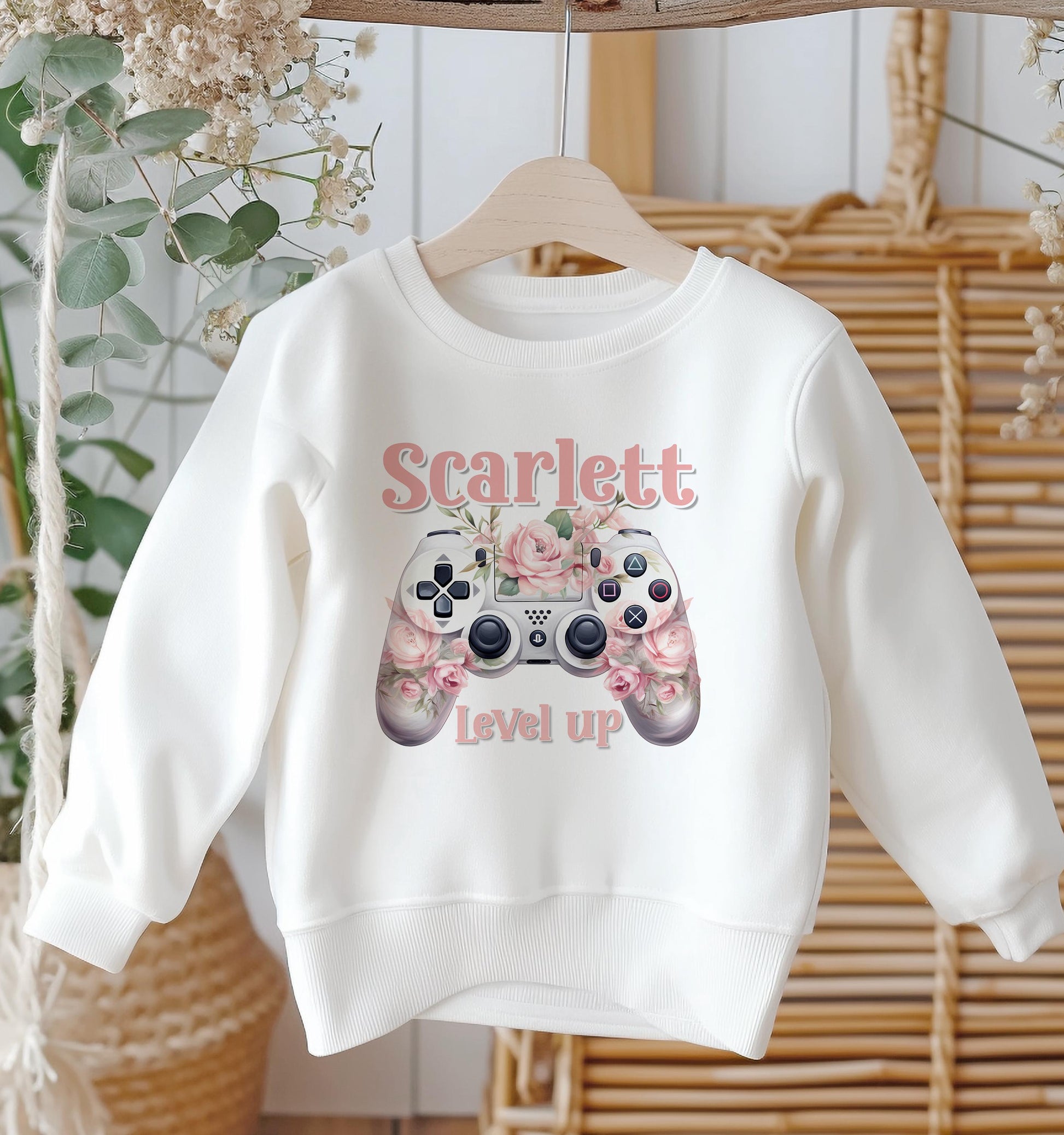 Personalised white cotton sweatshirt with flower and gaming controller design and custom name, baby size 6-12 months