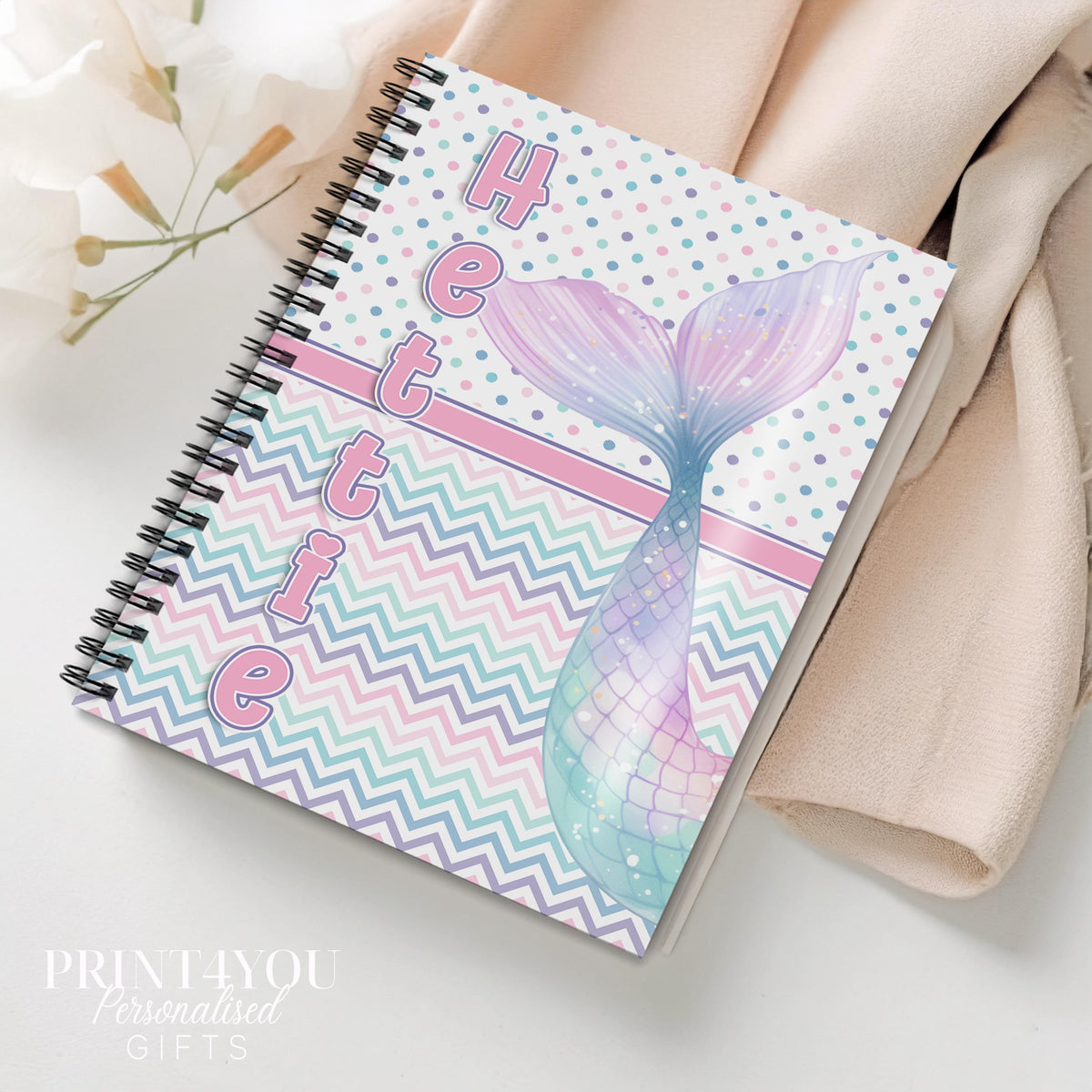 Personalised A5 mermaid notebook with pastel rainbow mermaid tail design, spiral binding and custom name on the cover