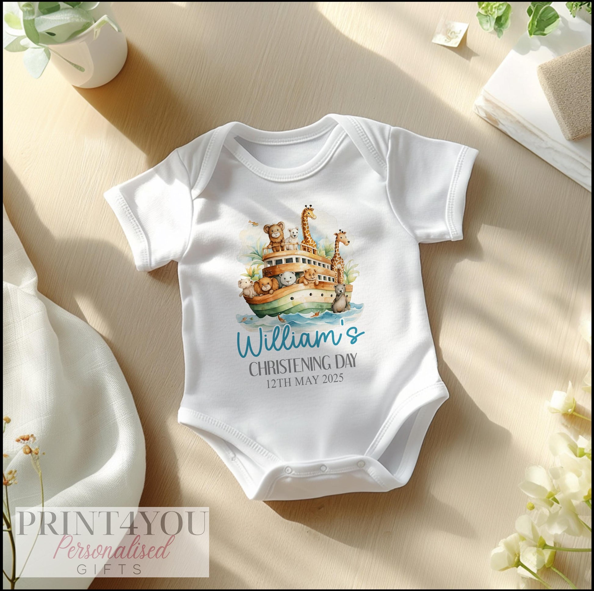 Personalised Noah's Ark christening bib, soft cotton printed with baby's name and date.