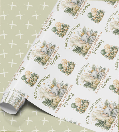 Personalised birthday wrapping paper in sage green with a baby elephant, wrapped presents and balloons, Happy Birthday with a relation and name