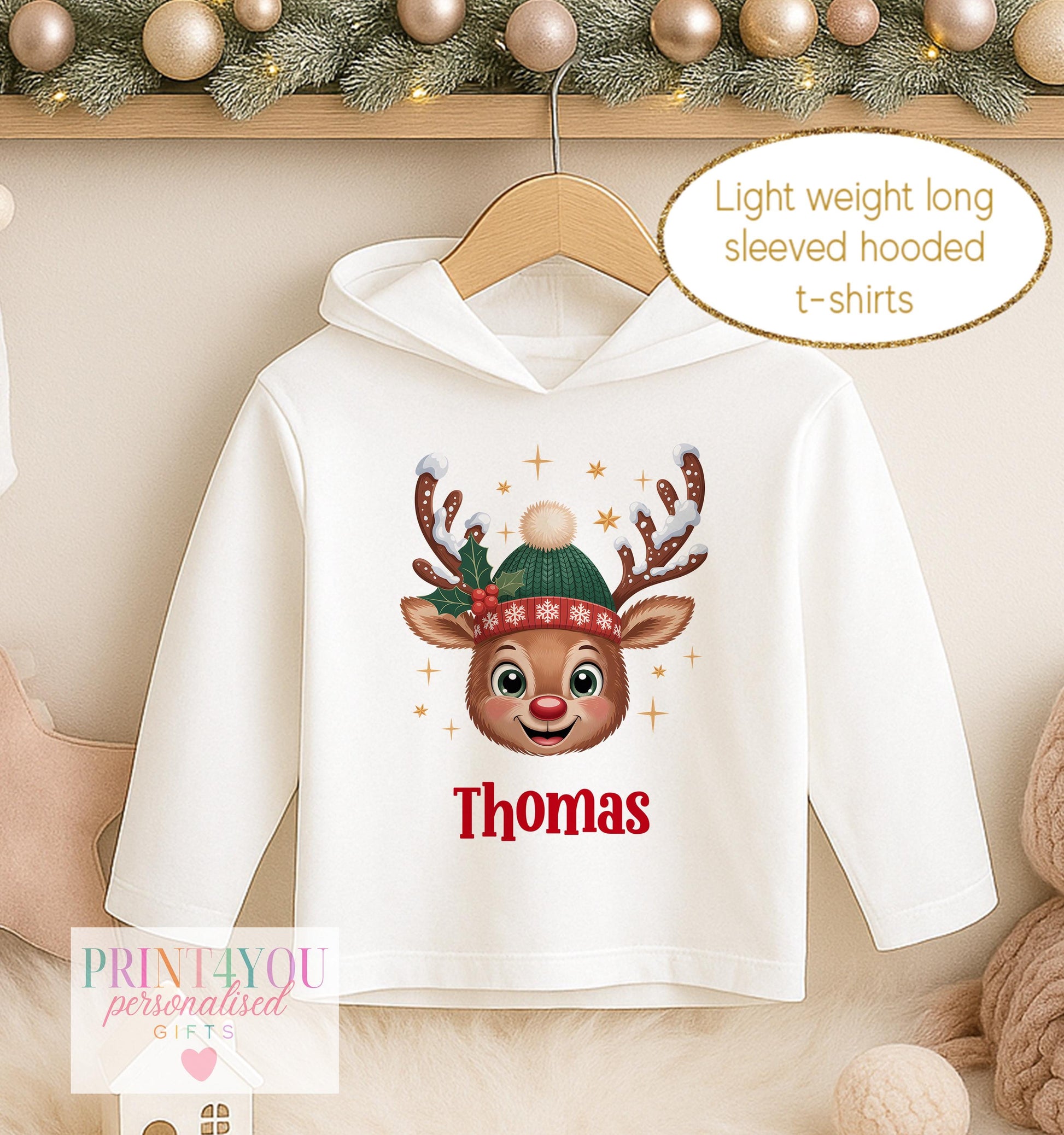 Personalised Christmas hooded t-shirt for boys, white lightweight long sleeved hoodie printed with a cartoon reindeer in a green hat and a name