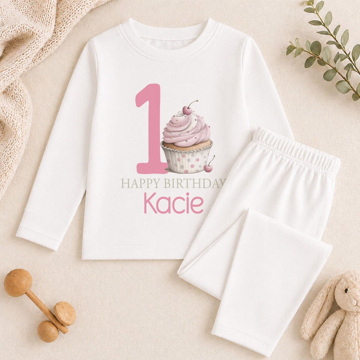 Personalised pink cupcake 1st birthday pyjamas with the child's name printed on soft cotton