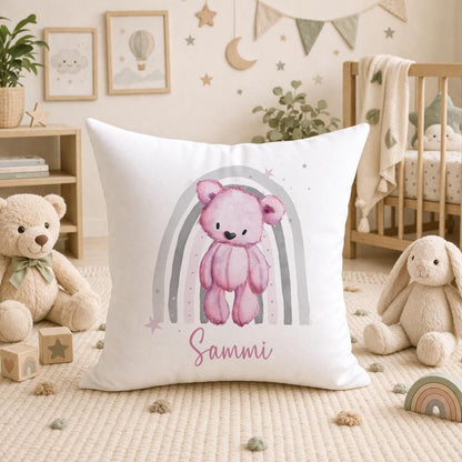 Personalised teddy bear cushion with a pink rainbow nursery design, front view