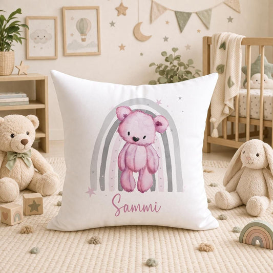 Personalised teddy bear cushion with a pink rainbow nursery design, front view