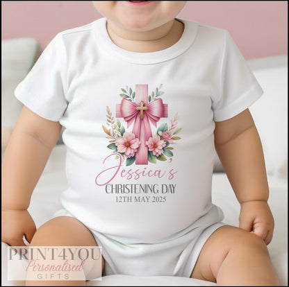 Close-up of the personalised pink cross christening design with baby's name printed below