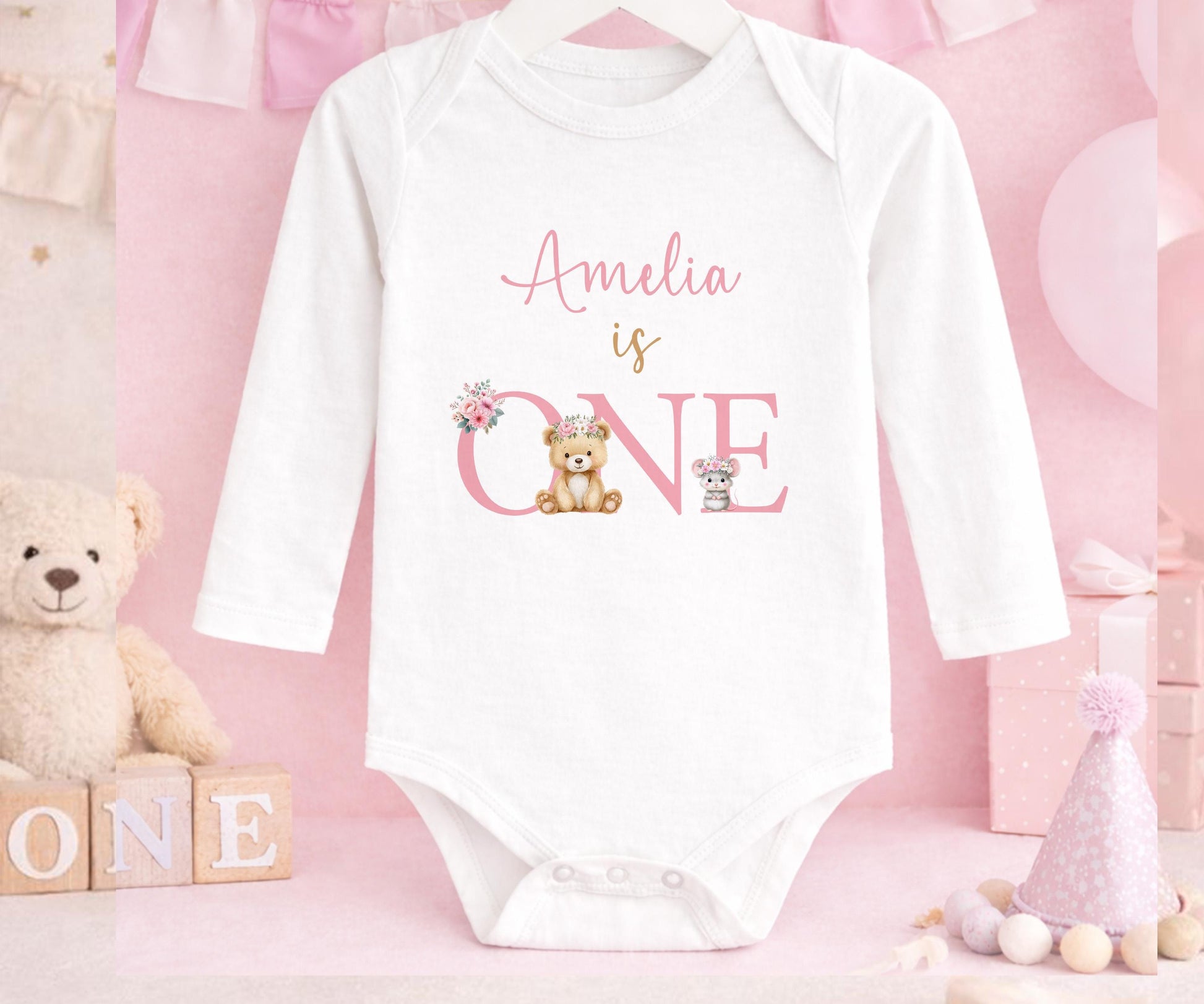 Personalised first birthday long sleeved vest with floral teddy bear design and custom name