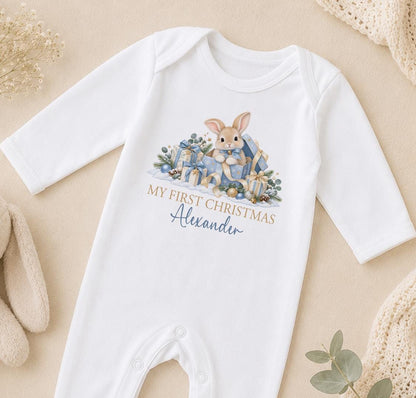 Personalised My First Christmas 2026 baby outfit with blue bunny and presents design on white cotton vest sleepsuit bib and baby t shirt