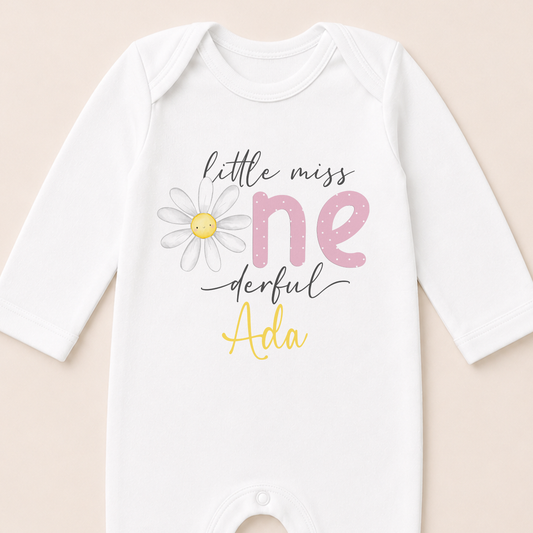Personalised Little Miss One-derful Daisy first birthday sleepsuit printed with your baby's name.