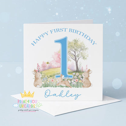 Side angle of the blue bunny first birthday card showing the square card format and card stock
