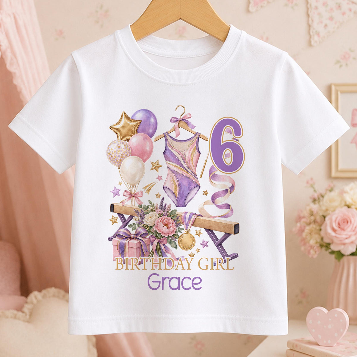 Personalised white t-shirt with a watercolour gymnastics leotard, balance beam, medal and balloons, an age number and Birthday Girl above a name