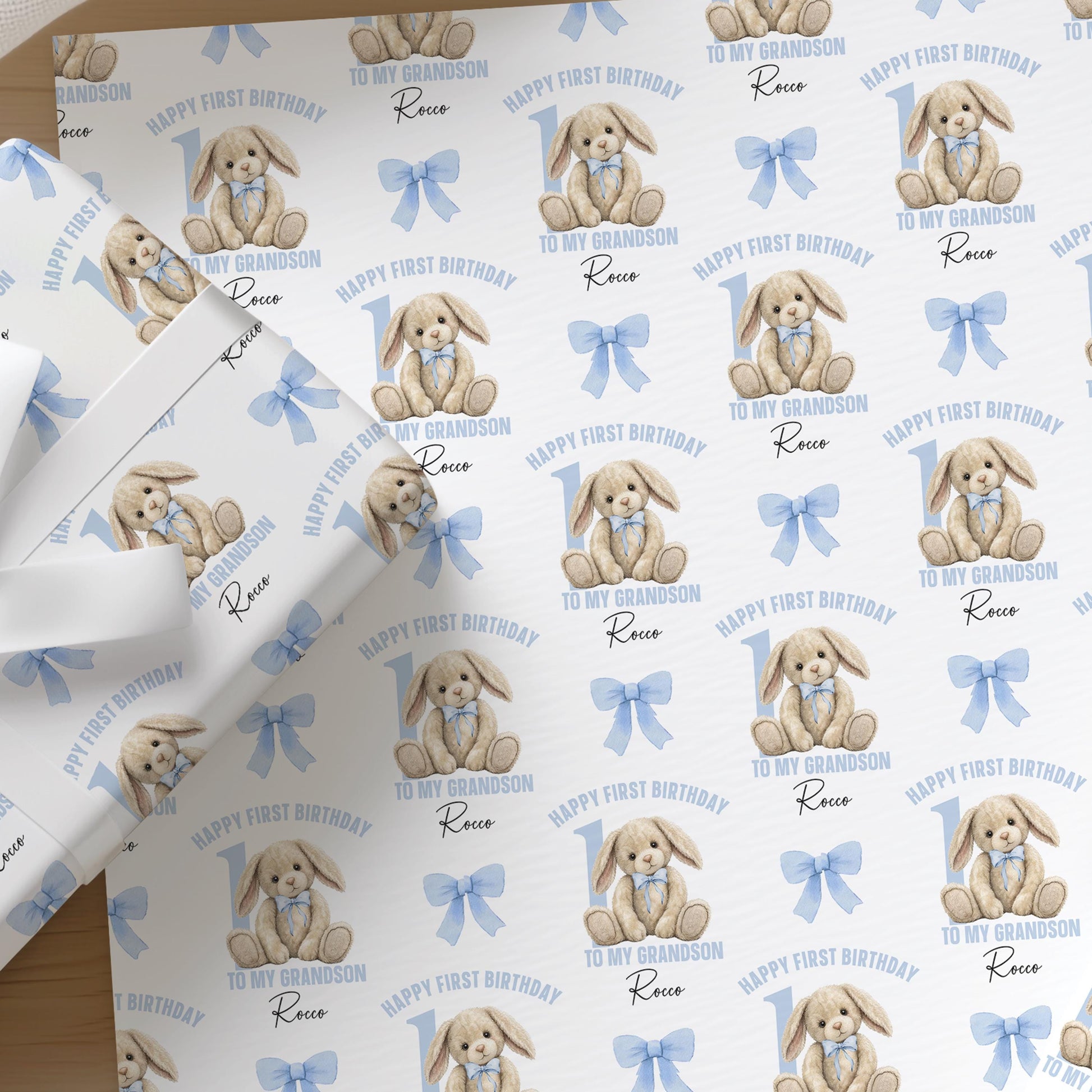 Repeating pattern of a baby rabbit design on personalised wrapping paper for a boy's 1st birthday
