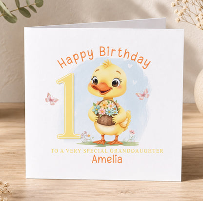 Birthday card featuring a cartoon duck holding flowers and a number one, printed with 'Happy Birthday 1 to a very special Granddaughter Amelia'.