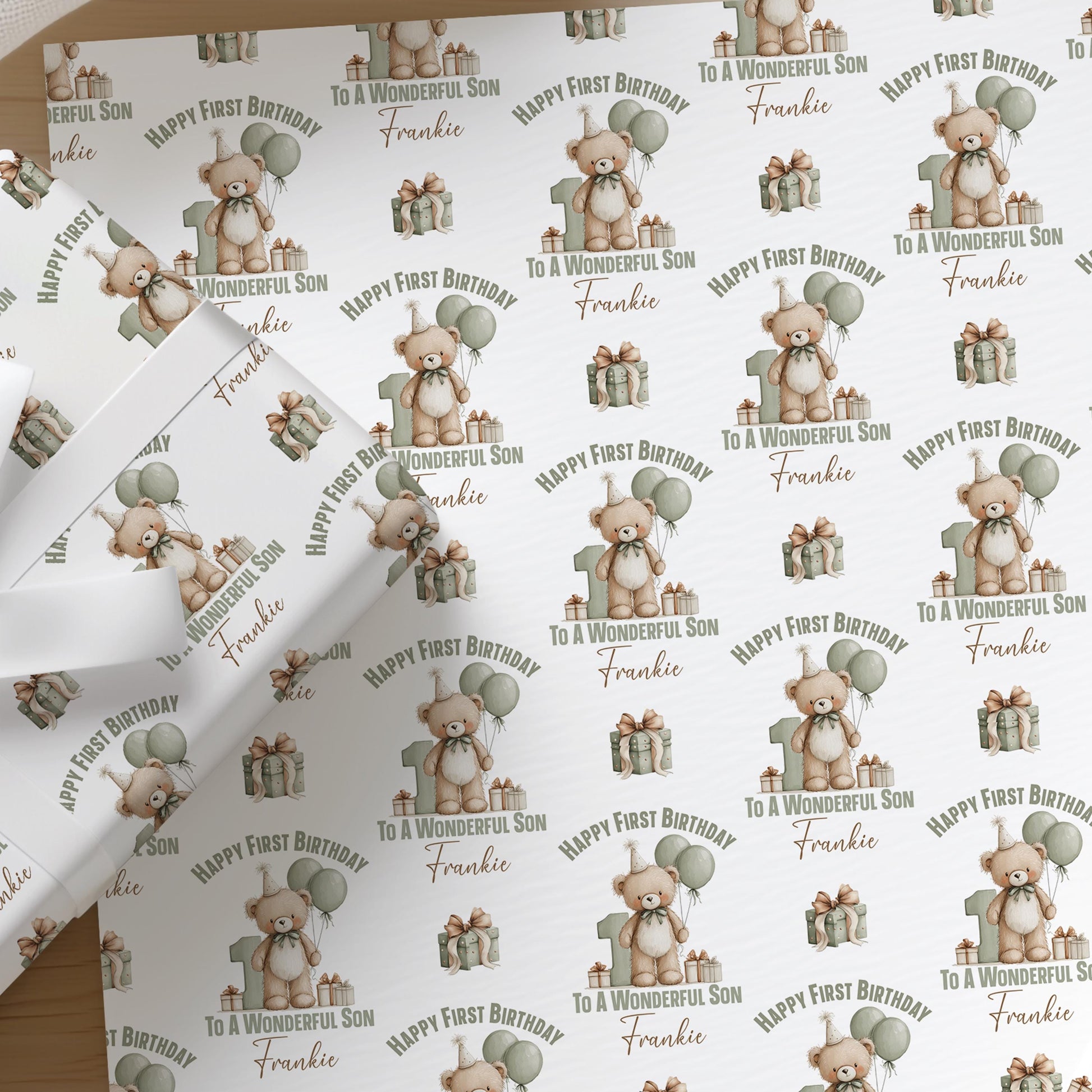 Personalised teddy bear wrapping paper printed with a custom name, shown as a full sheet