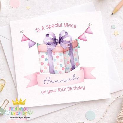 Square personalised birthday card with illustrated gift box design, name and age