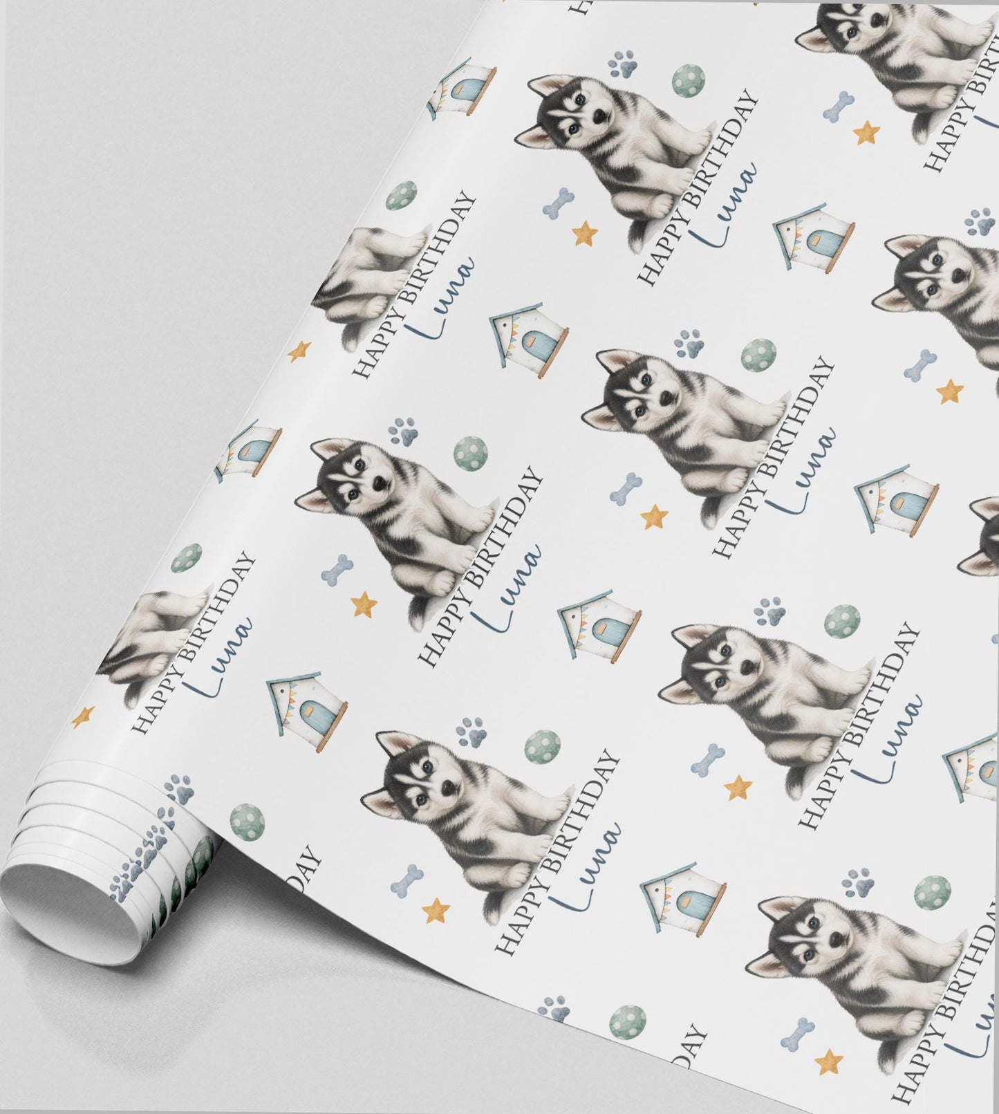 Personalised Husky birthday wrapping paper featuring a cute Siberian Husky puppy, custom name, paw prints and dog toys.