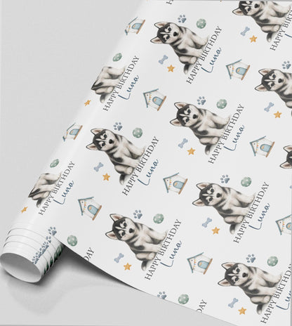 Personalised Husky birthday wrapping paper featuring a cute Siberian Husky puppy, custom name, paw prints and dog toys.