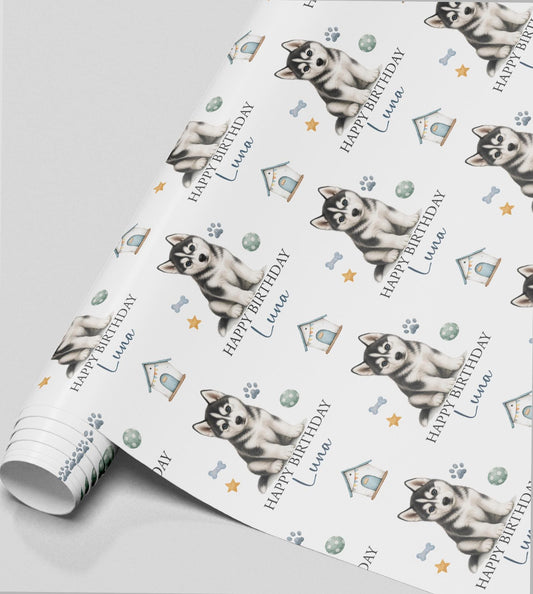 Personalised Husky birthday wrapping paper featuring a cute Siberian Husky puppy, custom name, paw prints and dog toys.