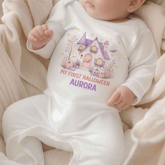 Personalised baby’s first Halloween white vest with a pastel pink and purple haunted house, cute ghosts, pumpkins and baby’s name.