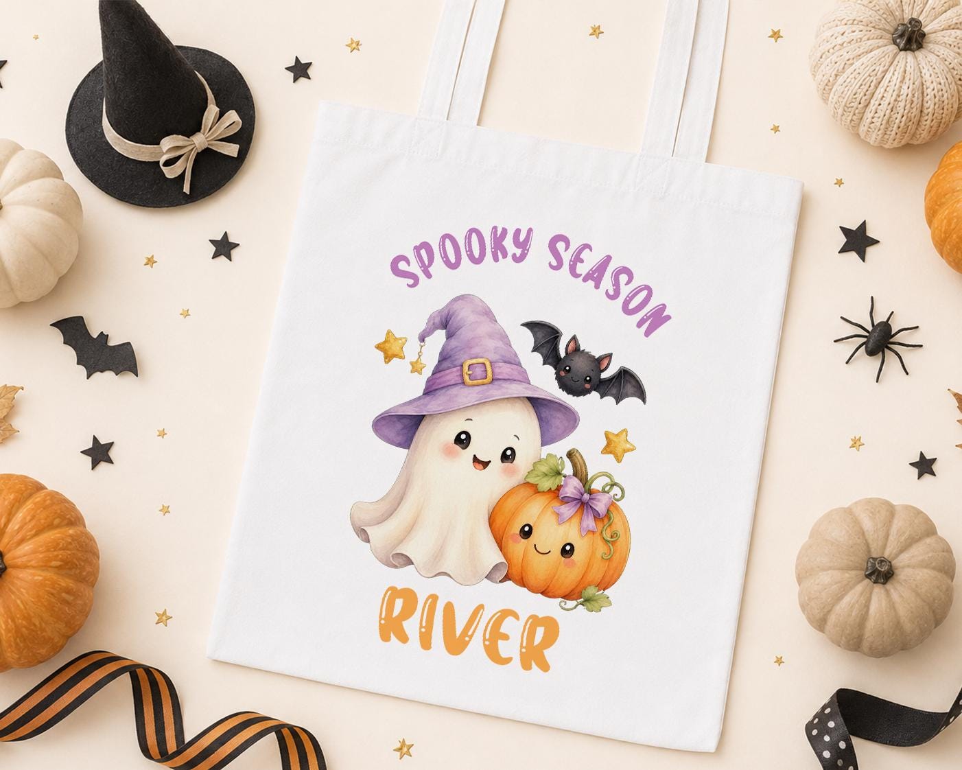 Personalised Halloween tote bag, white cotton bag printed with a ghost in a purple witch hat, a pumpkin and a bat with Spooky Season and a name