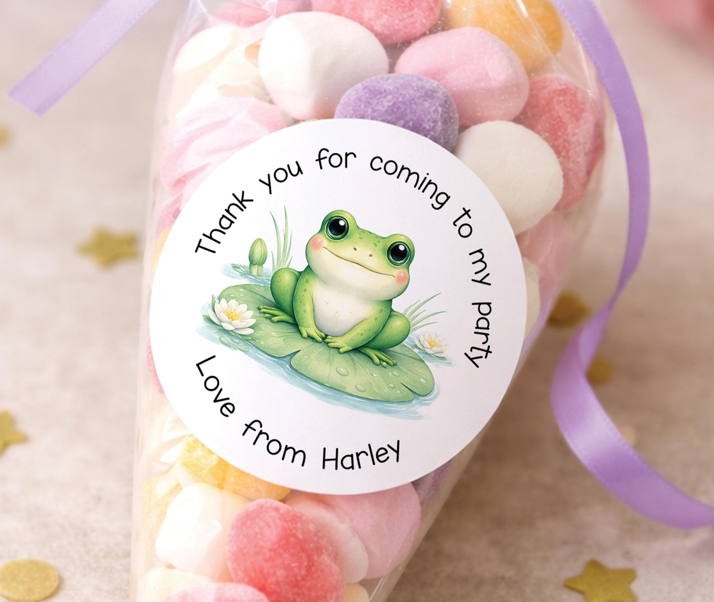 Personalised glossy round sticker featuring a smiling green frog design, printed with a child's name