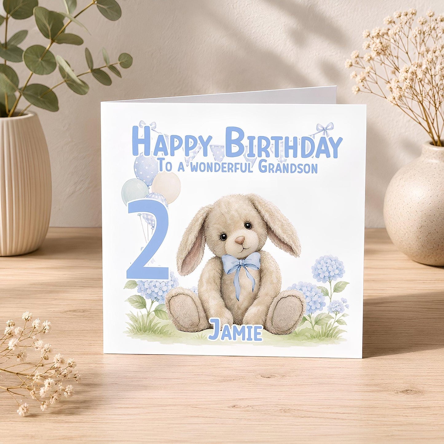 2nd birthday card front design featuring a blue bunny illustration, personalised with the child's name, age and relation.