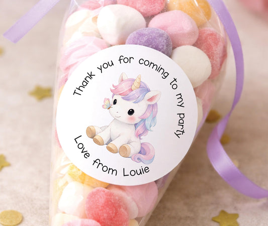 Round glossy stickers featuring a pastel unicorn design used as thank-you tags, personalised with a name