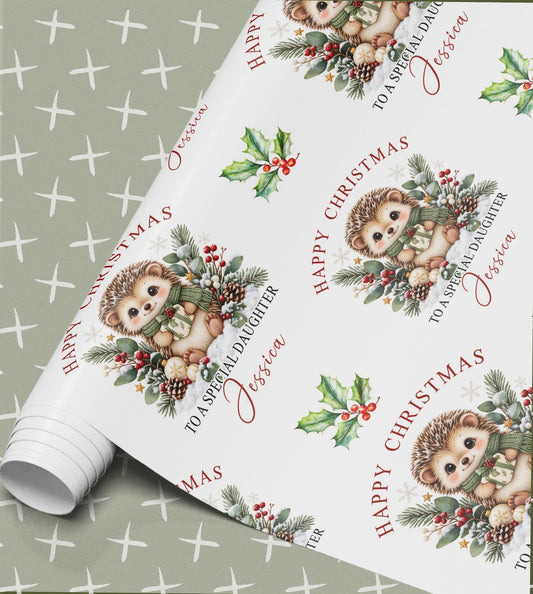 Rolled sheet of personalised hedgehog Christmas wrapping paper printed with a name and relation