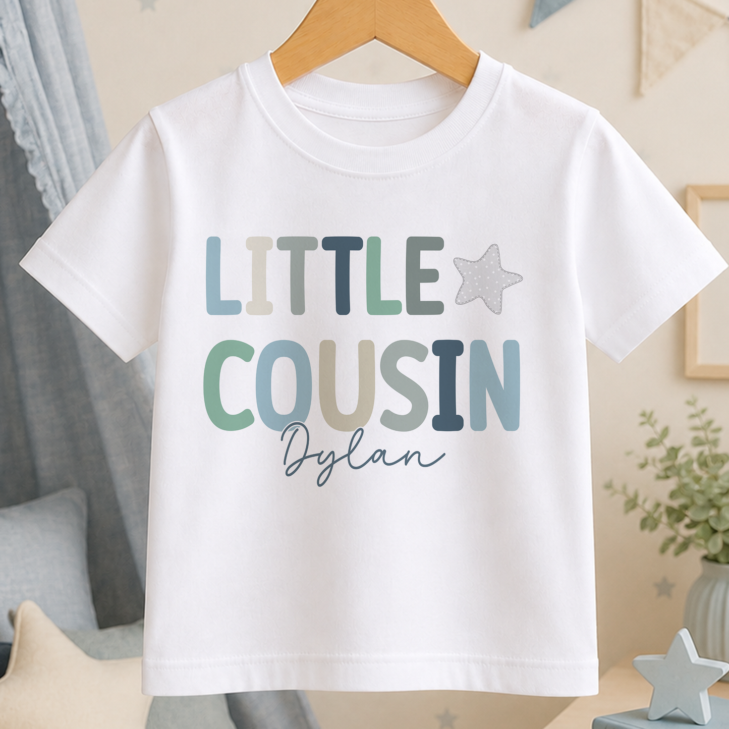 A white t-shirt with the text "LITTLE COUSIN Dylan" printed on it.