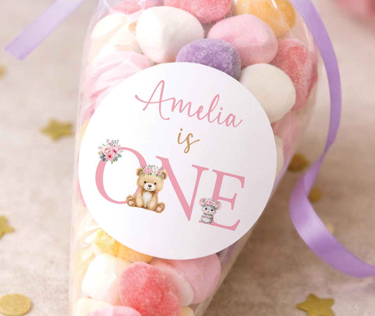 Round glossy stickers featuring a floral teddy bear design for a first birthday, personalised with a name