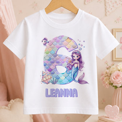Personalised mermaid design t-shirt for girls in white cotton, printed with an example name to show the personalisation.