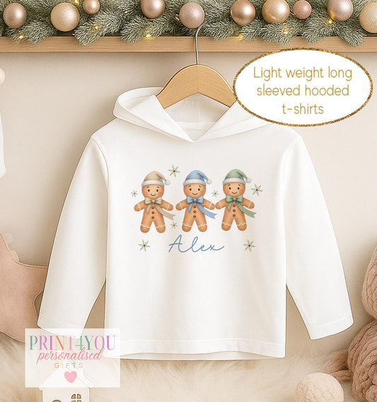 Personalised Christmas hooded t-shirt for boys, white long sleeved hoodie printed with three gingerbread men in blue bobble hats and a name