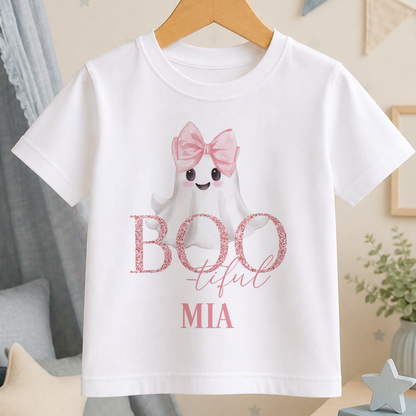 A white t-shirt with a ghost character wearing a pink bow and the text "BOOFUL MIA" printed on it.