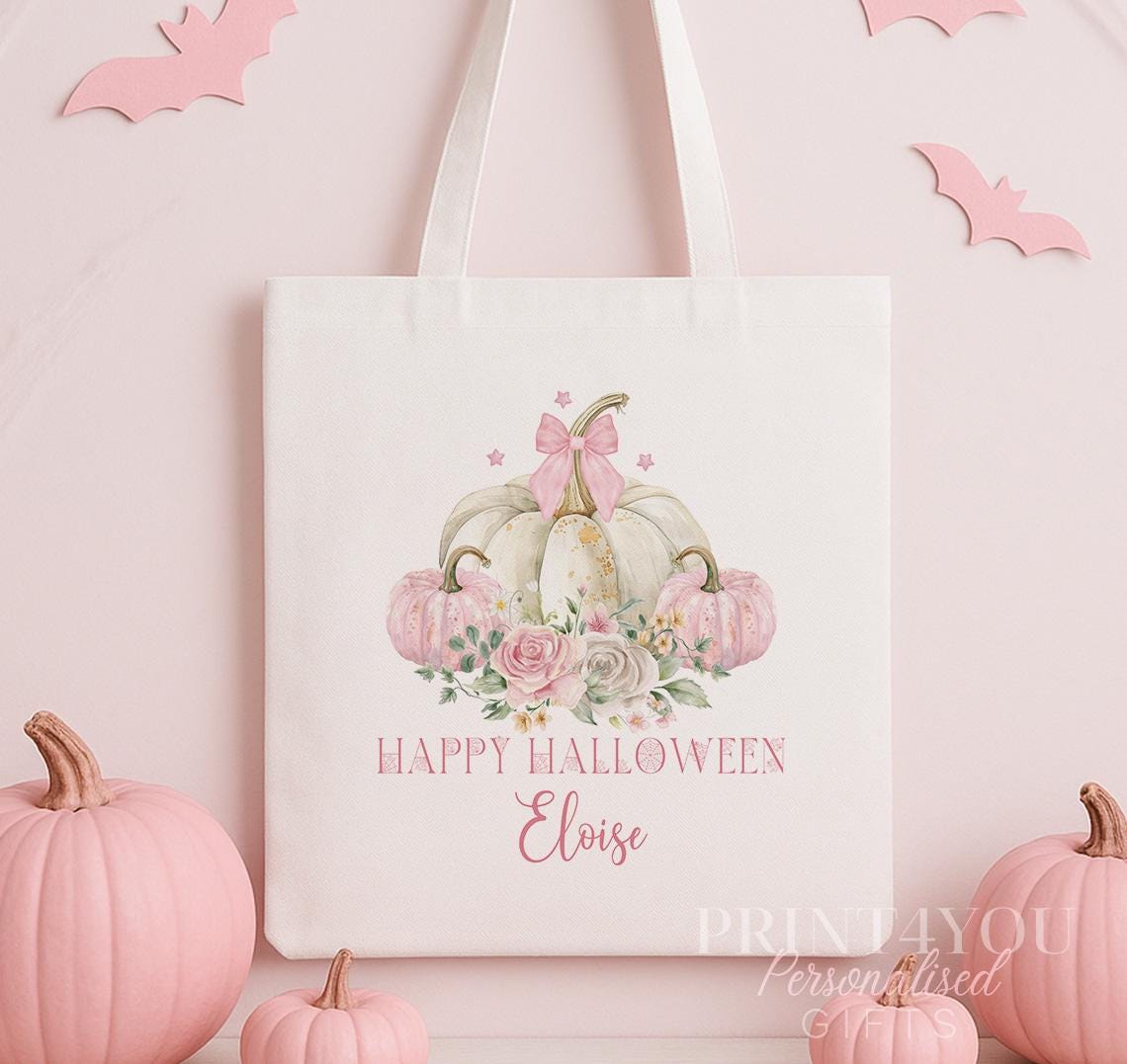 Cotton tote bag printed with a pastel pumpkin, delicate florals and a pink bow, personalised with a custom name on the front.