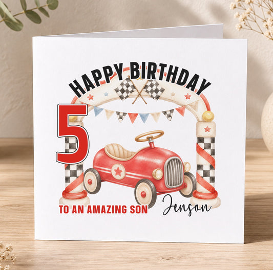 Square birthday card reading Happy Birthday with a red vintage pedal car, chequered racing flags and bunting, personalised To an Amazing Son Jenson 5.