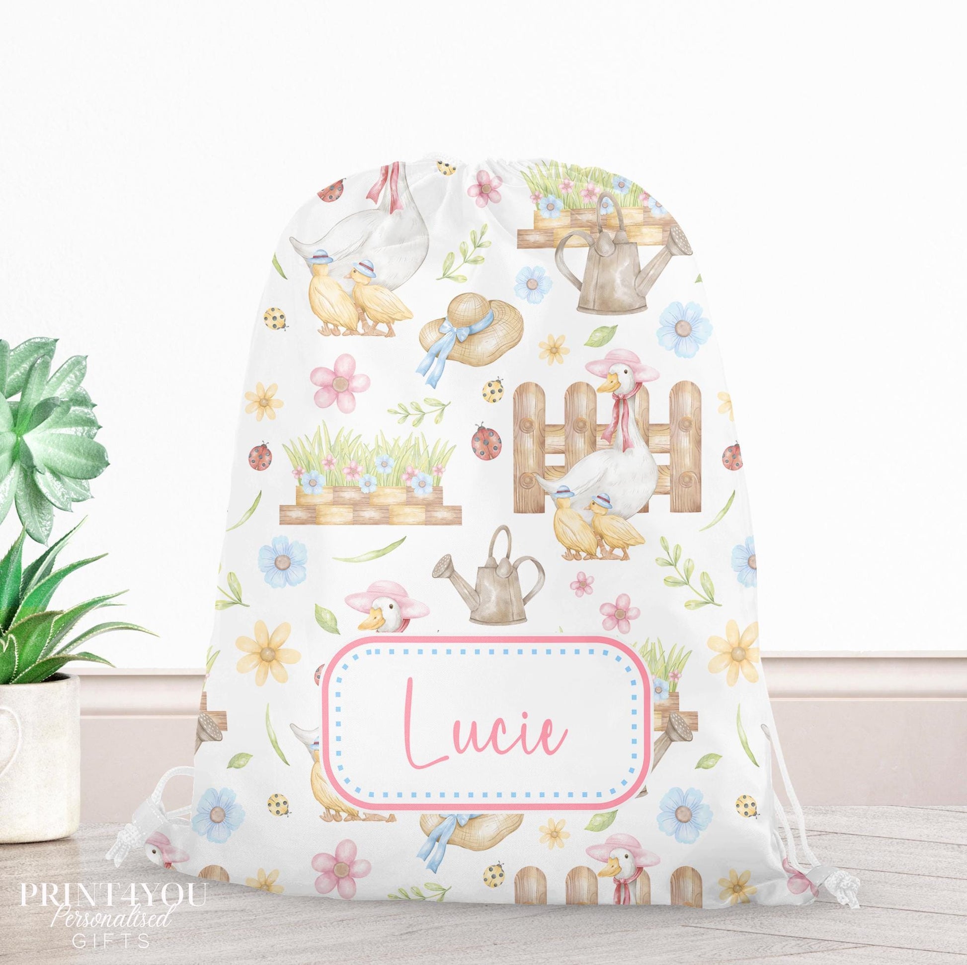 Personalised goose garden drawstring PE bag with pastel flowers, watering cans and ladybirds, printed with a custom name on the front
