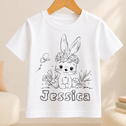 A white t-shirt with a black and white illustration of a bunny wearing a flower crown and the name " Jessica " written below it.