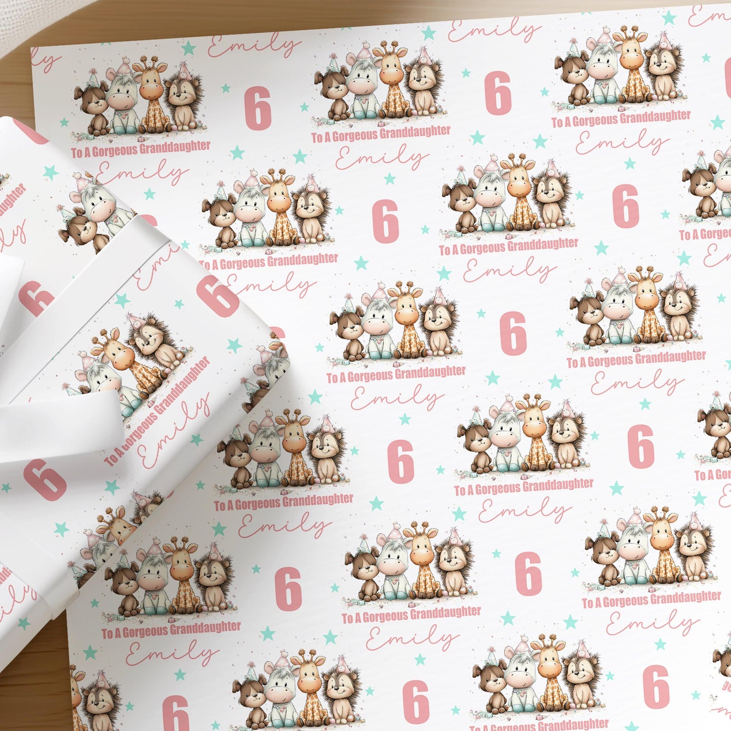 Personalised animal birthday wrapping paper for girls with a custom name and age, featuring dog, horse, giraffe and hedgehog characters