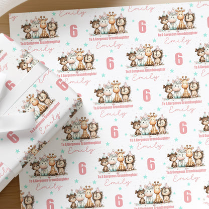 Personalised animal birthday wrapping paper for girls with a custom name and age, featuring dog, horse, giraffe and hedgehog characters