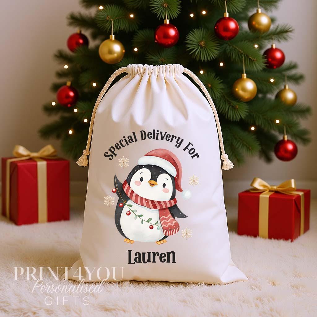 Personalised penguin Christmas sack, cream cotton drawstring santa sack printed with a penguin in a Santa hat and Special Delivery For a name