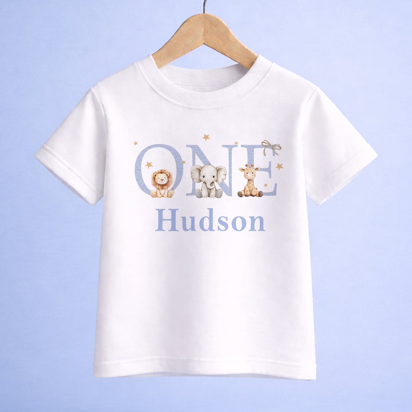 Personalised jungle safari first birthday bodysuit with a giraffe, elephant and lion design and custom name printed underneath.