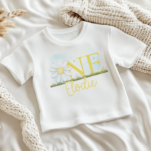 Personalised daisy first birthday bib, printed with baby's name.