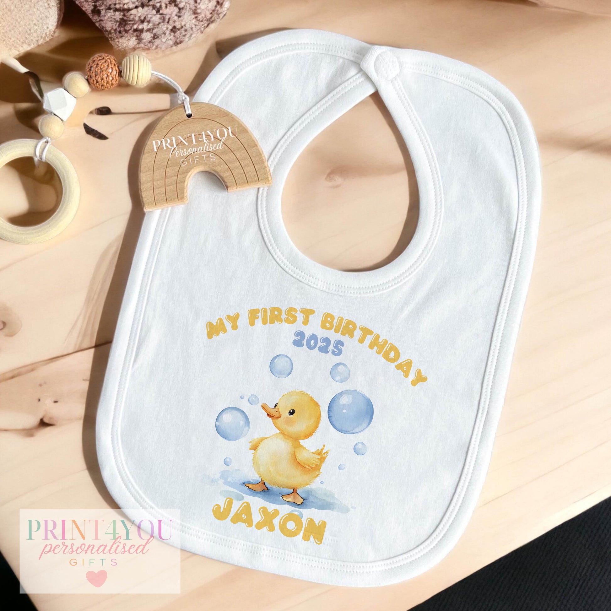 Personalised bubble duck first birthday sleepsuit printed with baby's name