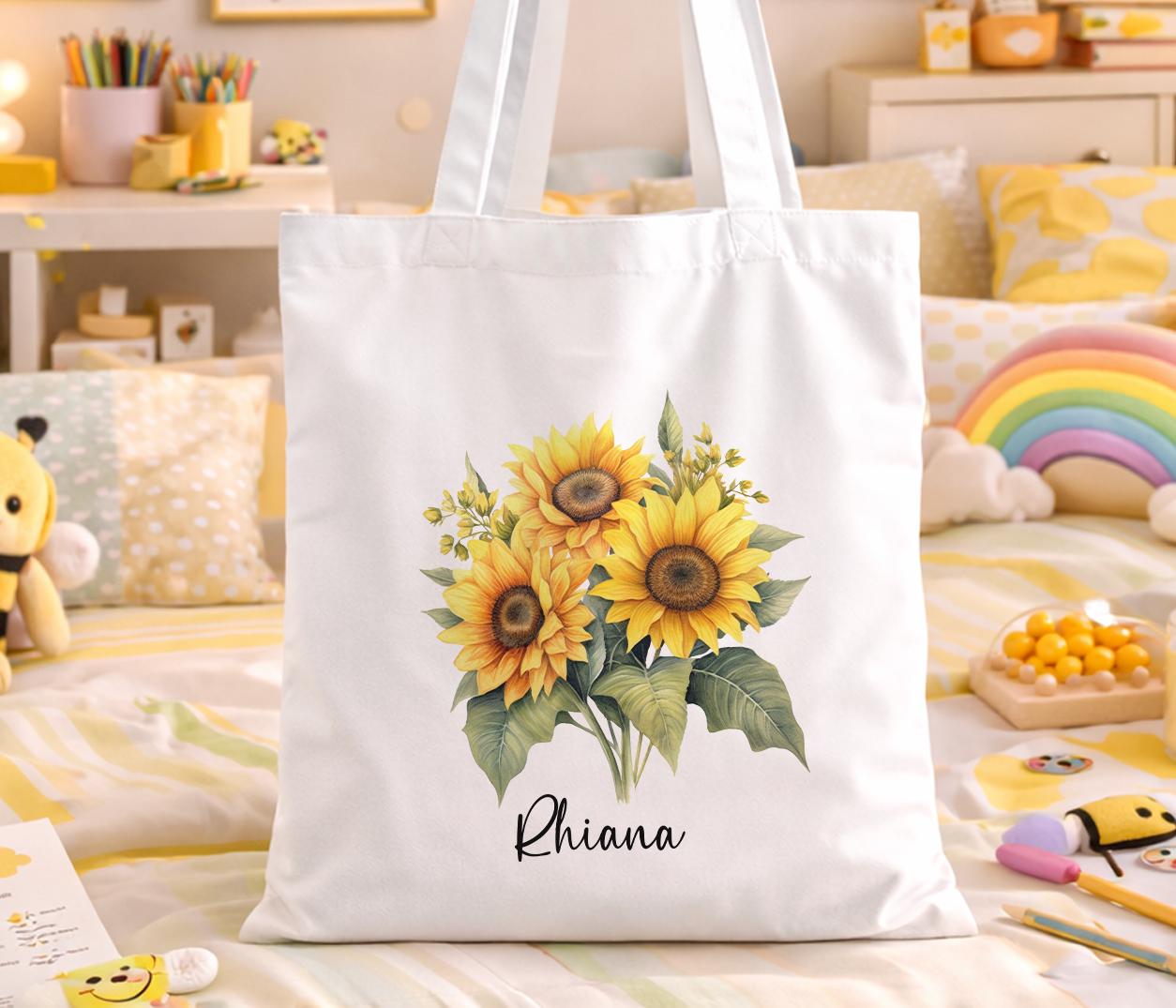 Cotton canvas tote bag printed with a vivid yellow sunflower design and personalised with a custom name