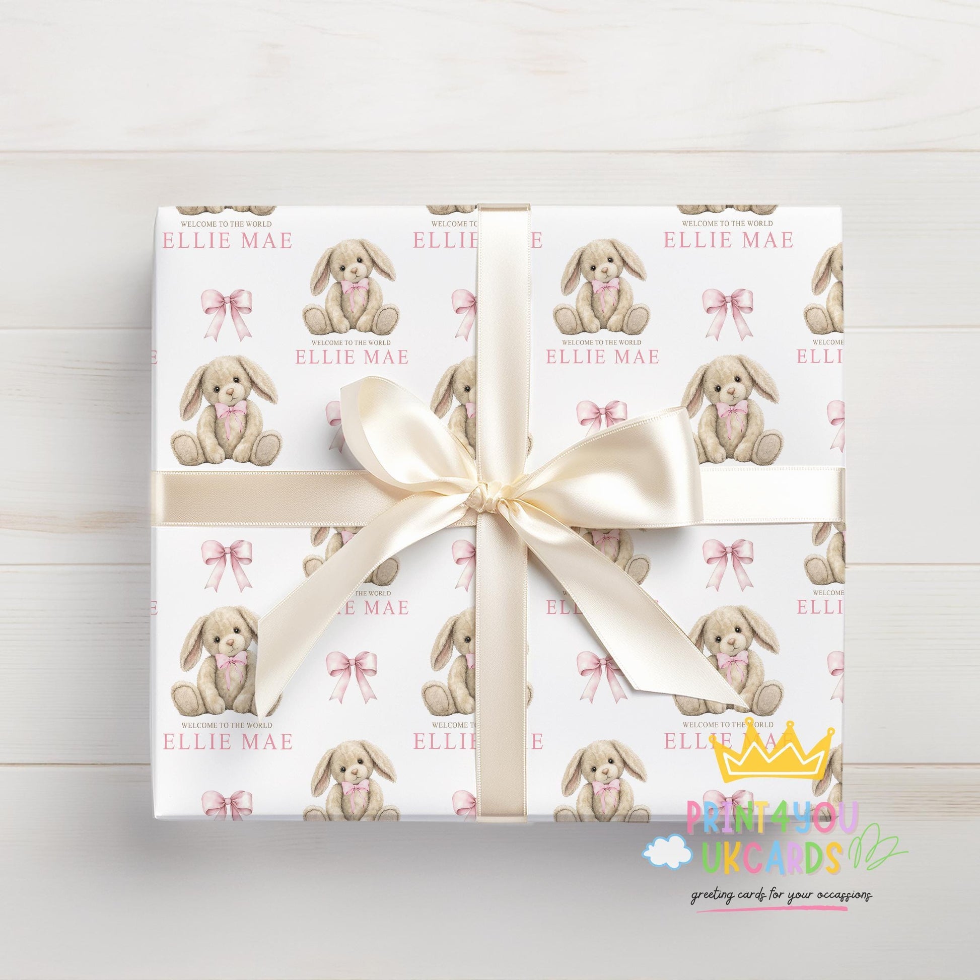 Personalised bunny teddy wrapping paper rolled and shown with a tape measure to indicate width.