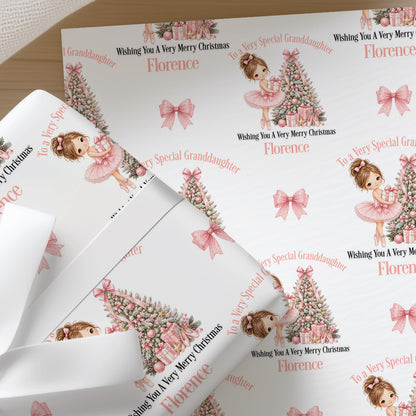 Sheets of the personalised ballerina Christmas wrapping paper ready to wrap
